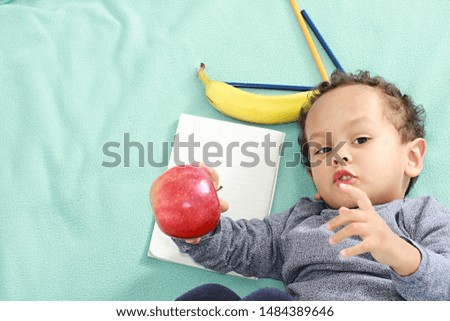 Little boy drawing on his note pad with his colouring pens stock image stock photo