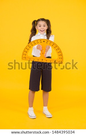 Engineering course. Geometry concept. Schoolgirl holding protractor for lesson. Little child preparing for geometry. Adorable small girl using measuring instrument. Study geometry. Future architect.