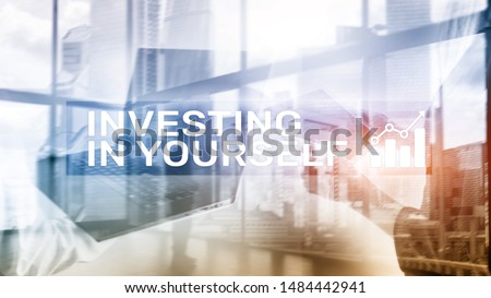 Invest in yourself. Personal development and education concept on abstract blurred background.