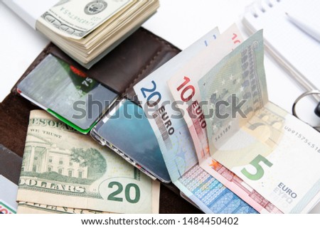 money dollars and euros, payment cards, leather wallet - payment concept photo