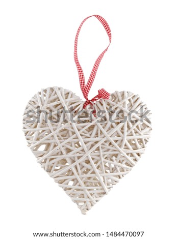 Decorative wooden white heart on white isolated background. It is an ornament with a red bow. Can be hung on the door or somewhere in the apartment and outdoors.