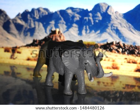 Picture of a Toy elephant on Safari background