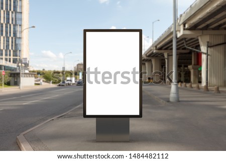 Blank street billboard poster stand mock up on city highway background. 