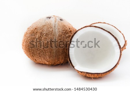 Coconut fruit is peeled and cut isolated on white background