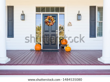 Fall Decoration Adorns Beautiful Entry Way To Home. Royalty-Free Stock Photo #1484535080