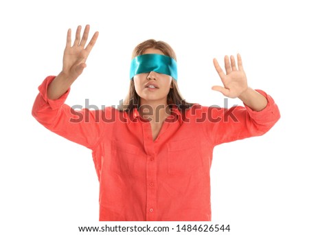 Young woman with light blue blindfold on white background