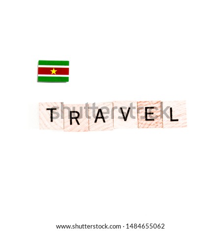 The Flag of Suriname and "TRAVEL" Wooden Block Letters