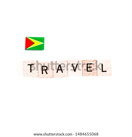 The Flag of Guyana and "TRAVEL" Wooden Block Letters
