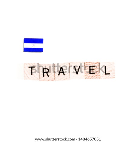 The Flag of Nicaragua and "TRAVEL" Wooden Block Letters