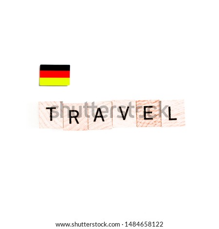 The Flag of Germany and "TRAVEL" Wooden Block Letters