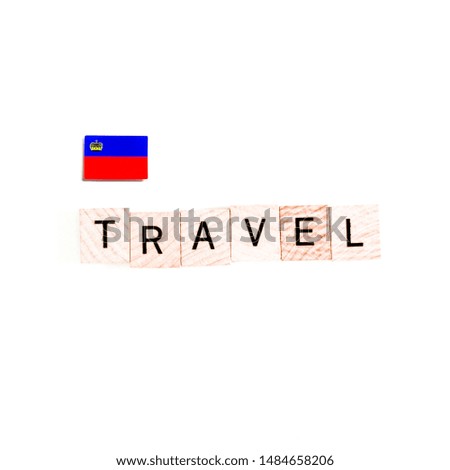 The Flag of Liechtenstein and "TRAVEL" Wooden Block Letters