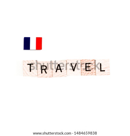 The Flag of France and "TRAVEL" Wooden Block Letters