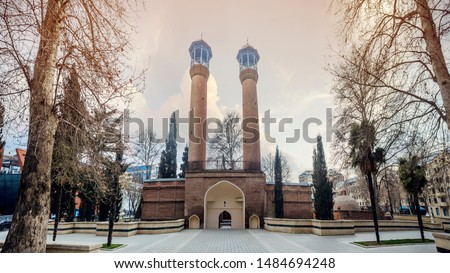 Azerbaijan, Ganja: Minarets of the Juma Ganja mosque or Friday Ganja mosque. The famous mosque is also often called the Shah Abbas mosque and was built in 1606 Royalty-Free Stock Photo #1484694248
