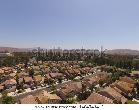 aerial view of residential homes in a suburban neighborhood 
