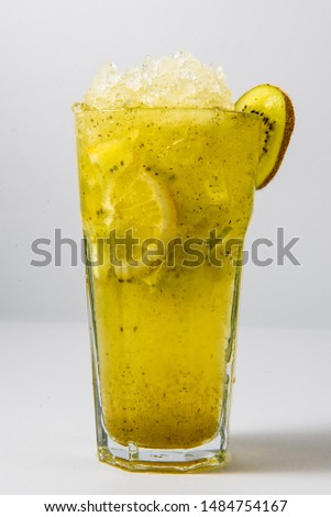 cold cocktail with kiwi and lemon on a white background