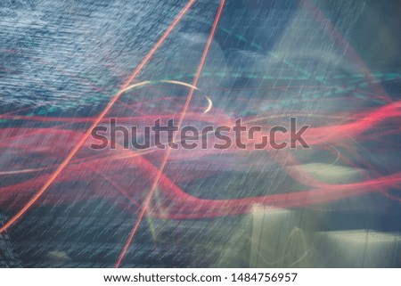 Abstract bright blurred neon trend background, multi-colored lines. Speed light beam night traffic and lights.