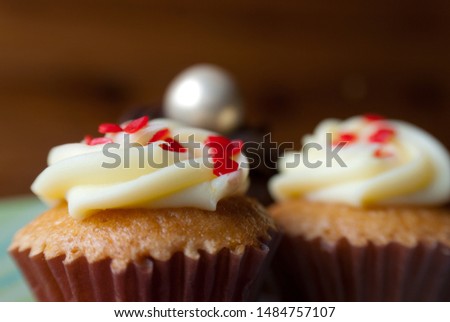 Close-up image of cupcakes on a dark table indoor