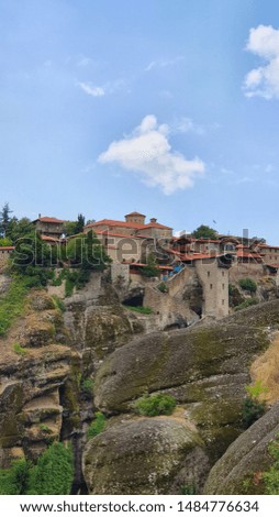 Old monasteries built on a cliff at the iconic rock formation of Meteora