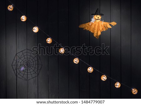 orange halloween ghost isolated on black background