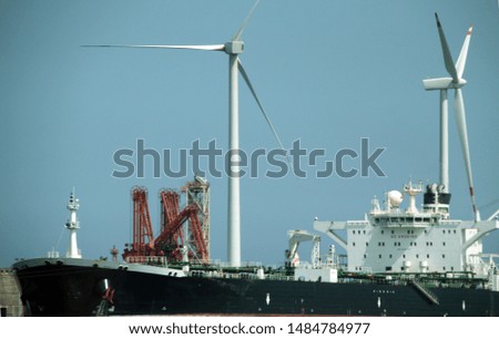 Wind mills close to a harbour