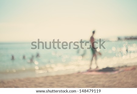 In the summer vacation.Silhouette of a man playing tennis on the beach.