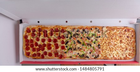 One Meter Long Pizza Directly from the Traditional Oven Served Royalty-Free Stock Photo #1484805791