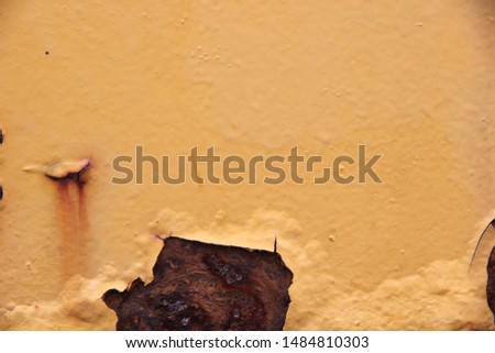 The old iron walls are brown with rust and glistening colors. Can be used as a background of graphic work.