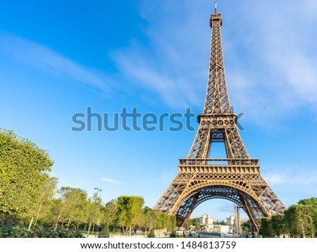 Eiffel Tower on blue sky background. Paris Best Destinations. Travel in Europe Concept. Landmark, Sightseeing, Summer holidays and vacation in France. Panoramic View.  Space for text.