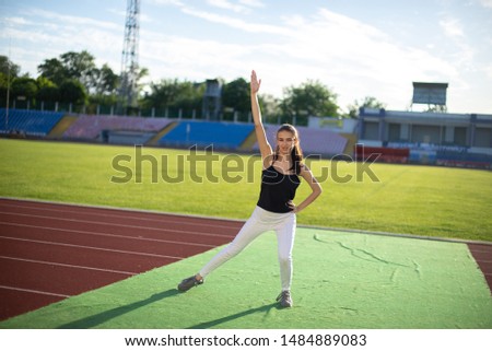 Young beautiful girl doing yoga outdoors in the park.