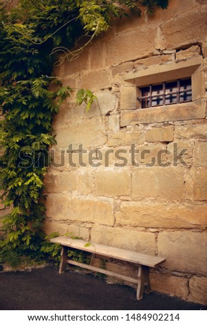 Bench near the castle. Summer. France. Couiza. Château des ducs de Joyeuse