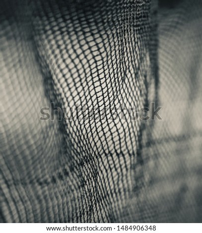 Parts of a nylon nets isolated black and white photo