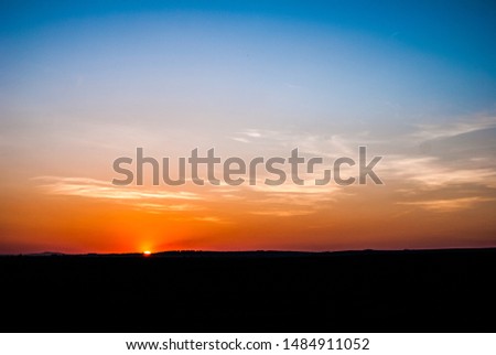 High contrast sky with orange clouds and sunset