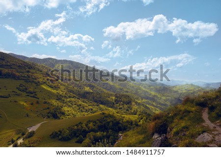 A general view of Bugarach. Mountains and fog in France. Sunny day and clouds. Blue sky and pretty view.