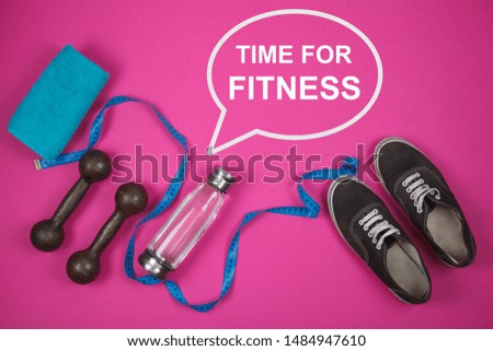 Fitness background with bottle of water, sport shoes on color texture