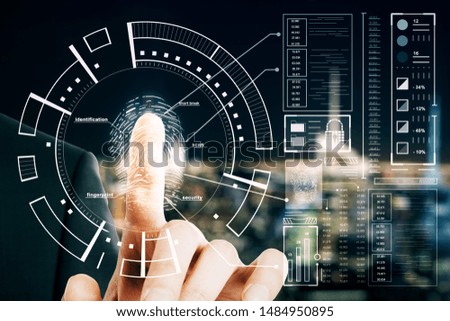 Protection and security concept with man finger pushed on digital screen with fingerprint anf cyberspace icons.