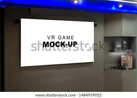 Mock up horizontal blank VR Game screen hanging on the wall in showroom, empty space for insert media information show and presentation playing test