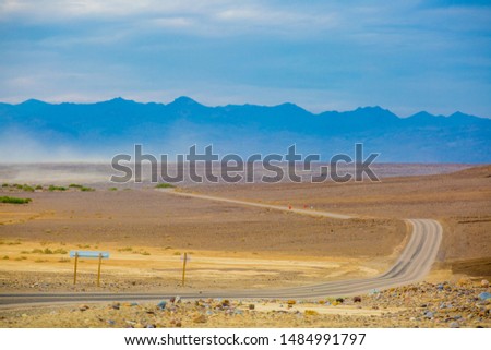 A road running through the endless scenery during summer in Death Valley National Park, California, USA