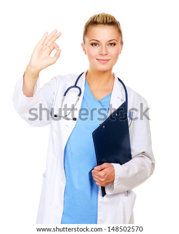 A female doctor shows a sign okay  with folder isolated on white background
