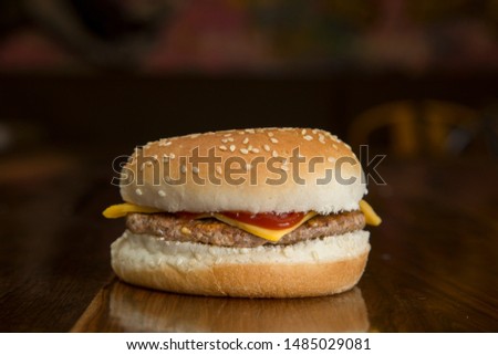 burger with cheddar and bacon and bread