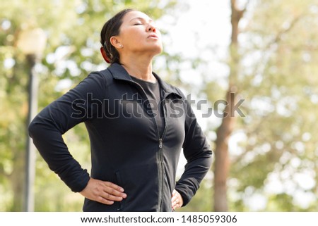 Asian woman meditating and breathing deeply. Royalty-Free Stock Photo #1485059306