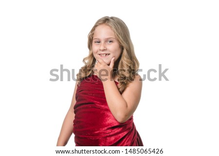 Little girl posing with red velvet dress on white background