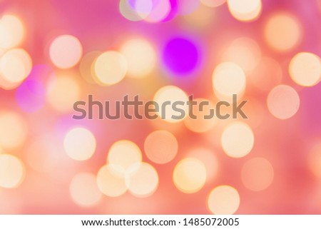 Christmas New year birthday holiday background with golden garland bokeh lights pastel pinkish backdrop. Template for poster card with copy space
