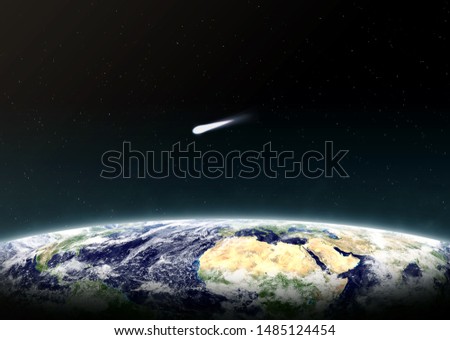 Planet earth and  comet. Comet moving over earth. Space background. Elements of this image furnished by NASA.