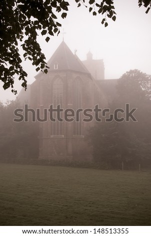 Foggy morning around the church in Elburg, Gelderland, Netherlands