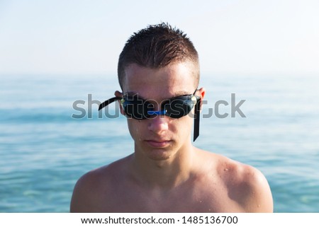 Close Up Portrait Of Young Swimmer 