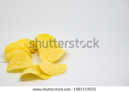 heap of potato chips isolated on white background,A bunch of potato chips on a white, closeup,with copy space.