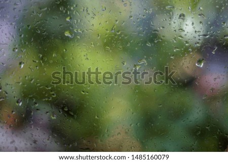 Glass with water droplets Green background.Close up