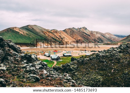 Breathtaking highlands landscape  background with colorful mountains green moss Icelandic pure natural fields and lakes craters rivers aerial view Landmannalaugar geothermal area Iceland and camp site