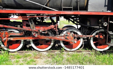 the wheels of an old locomotive