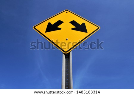 Left and right arrows on yellow sign Royalty-Free Stock Photo #1485183314
